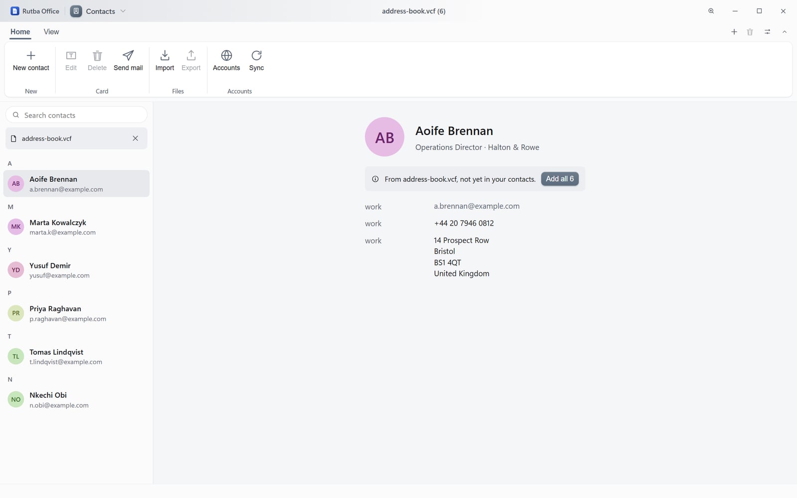 The Contacts app showing an address book grouped by initial with coloured monogram avatars, and a detail pane giving one person’s job title, organisation, work email, telephone number and postal address